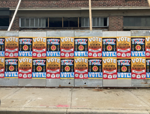 Wheatpaste signs encouraging passerbys to vote.